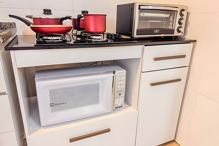 Flat completo em residencial + ar cond. e vaga